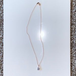 Rose gold with cubic zirconia.